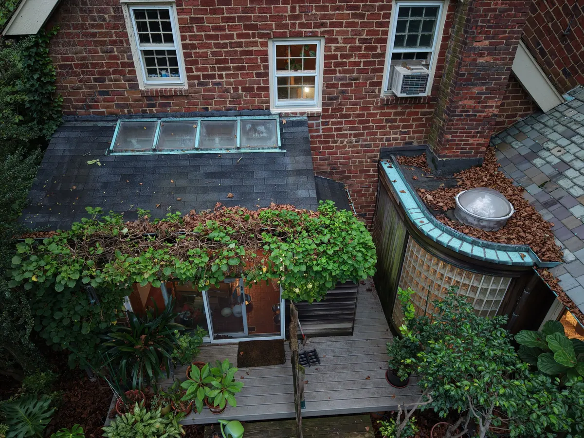 Copper bay roofs and a slate roof on a brick house on Jefferson Road in Princeton, NJ.