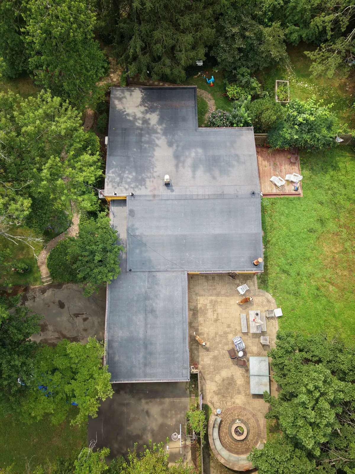 Drone view straight down on a new flat roof on a modern house on Deer Path in Princeton, NJ, by Pujols Roofing.