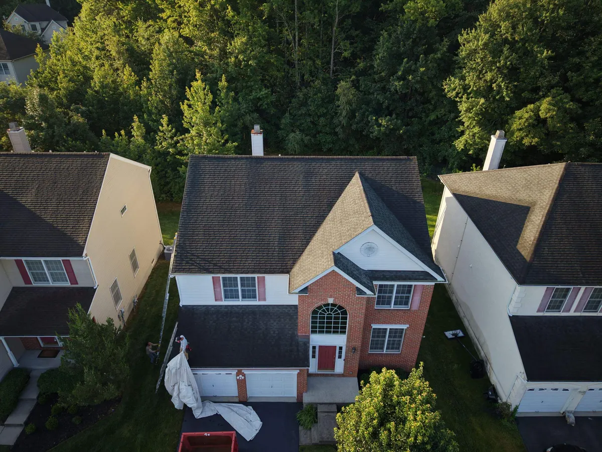 Drone view of a finished shingle roof on a colonial in Princeton, NJ, by Pujols Roofing.