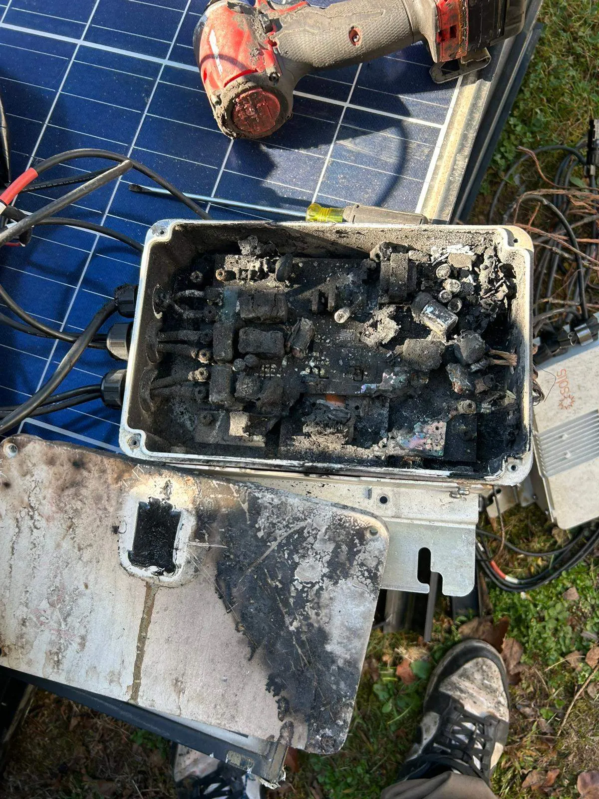 Burned-out solar junction box after a rooftop fire, found during the Pujols roof inspection in Franklin Township, NJ.