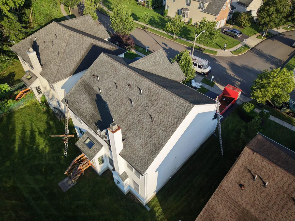 Drone view of the finished roof and the street on Lockwood Drive in Princeton, NJ, by Pujols Roofing.